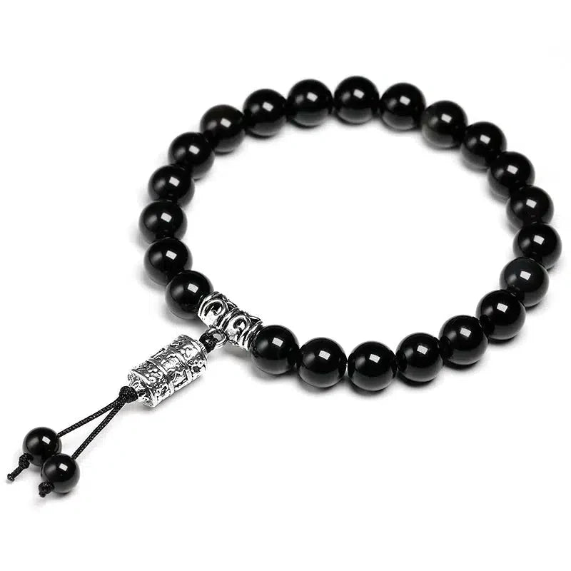 Vue d'ensemble du bracelet obsidienne noire avec breloque Om