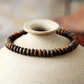 Vue latérale du bracelet en jaspe, perle centrale gravée