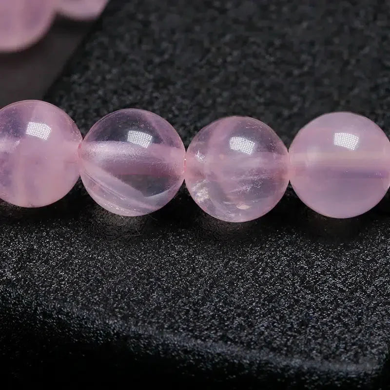 Bracelet tissé rose avec pierre centrale Om