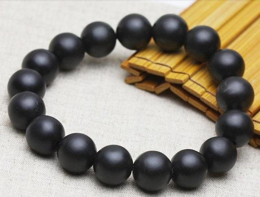 Bracelet Bianshi posé sur une surface en bois clair