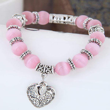 Vue d'ensemble du bracelet Opale Rose, perles rondes et élastiques