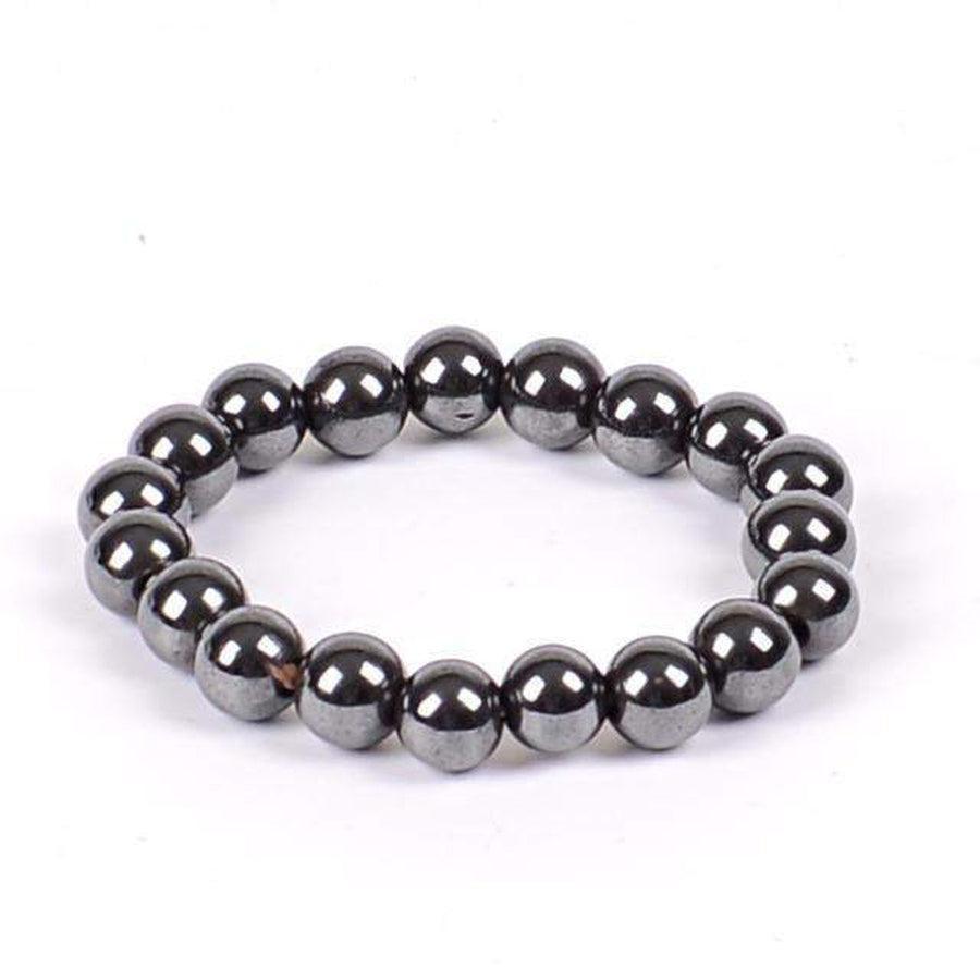Bracelet en hématite enroulé, montrant sa texture métallique