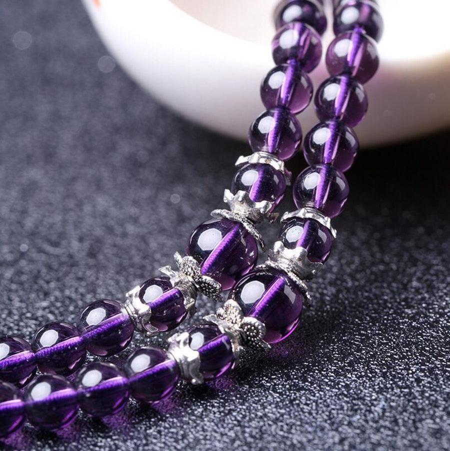 Bracelet Mala en améthyste avec pendentif cristal de roche