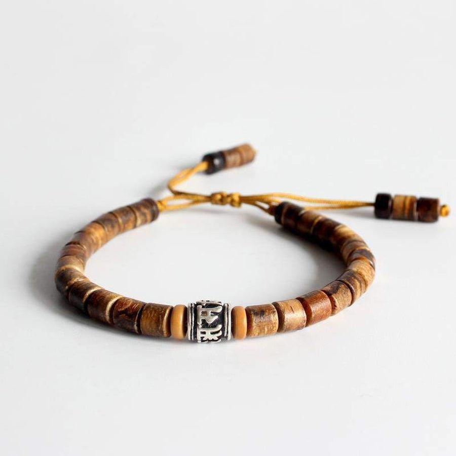 Bracelet en bois d'olivier avec perle en cuivre gravée