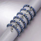 Vue d'ensemble du bracelet protecteur avec charms argentés