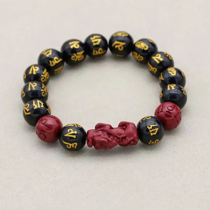 Bracelet élégant en obsidienne avec symboles spirituels