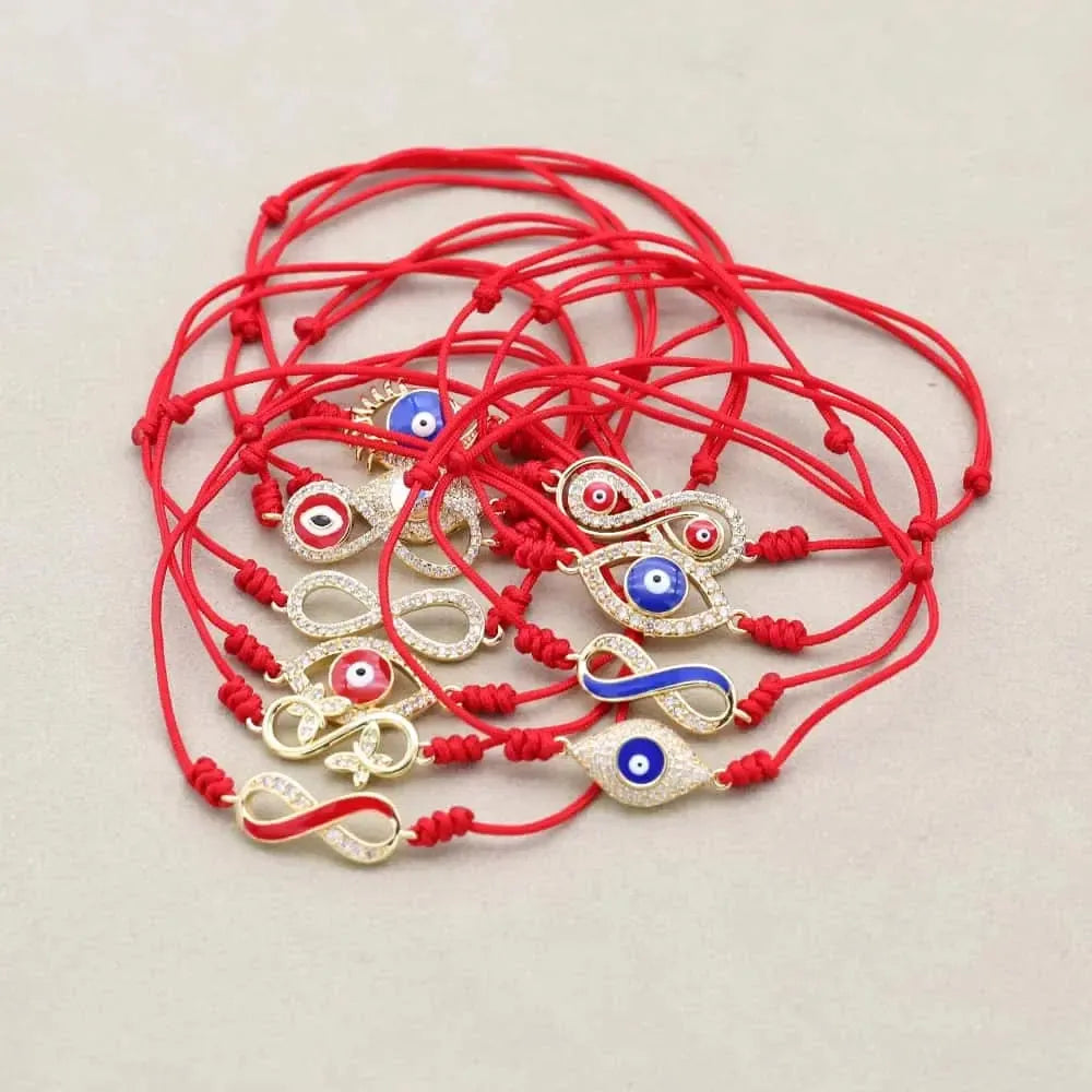 Bracelet rouge avec symbole infini et œil protecteur
