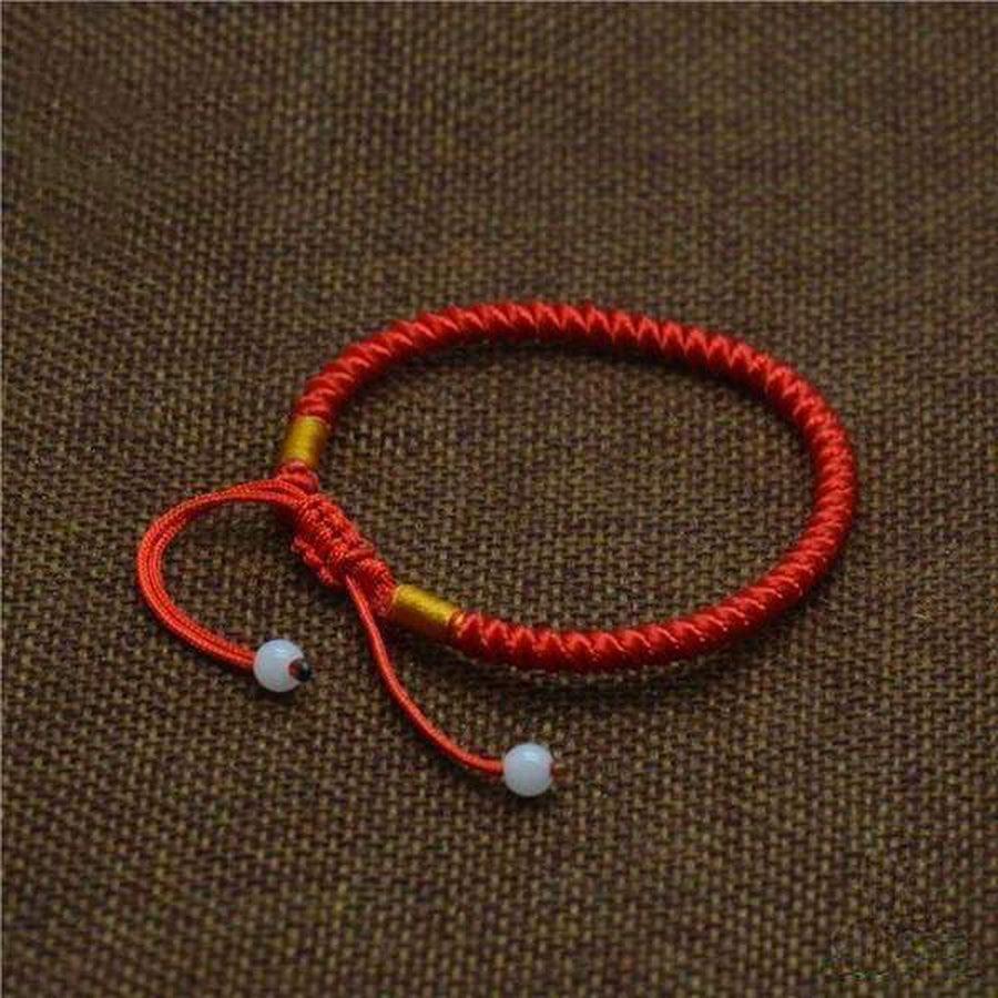 Bracelet rouge tressé avec perles de jade aux extrémités