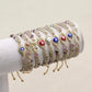 Bracelet ajustable en fluorite avec symboles spirituels