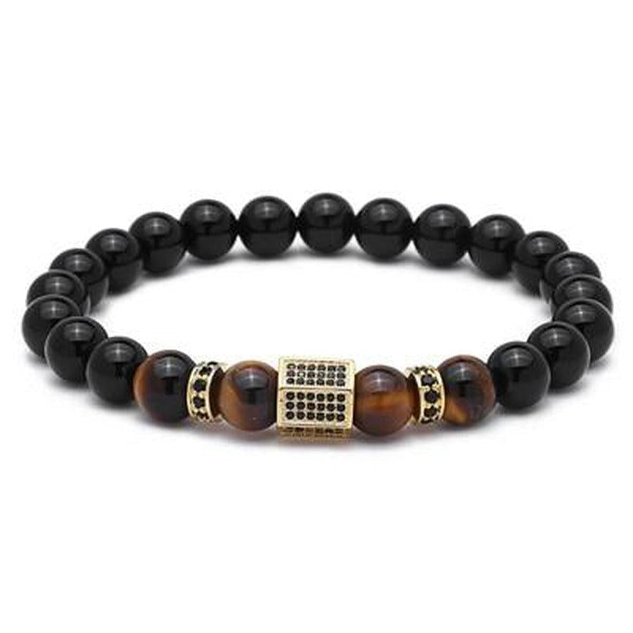 Détail des perles d'Agate noire et Oeil de Tigre sur fond clair