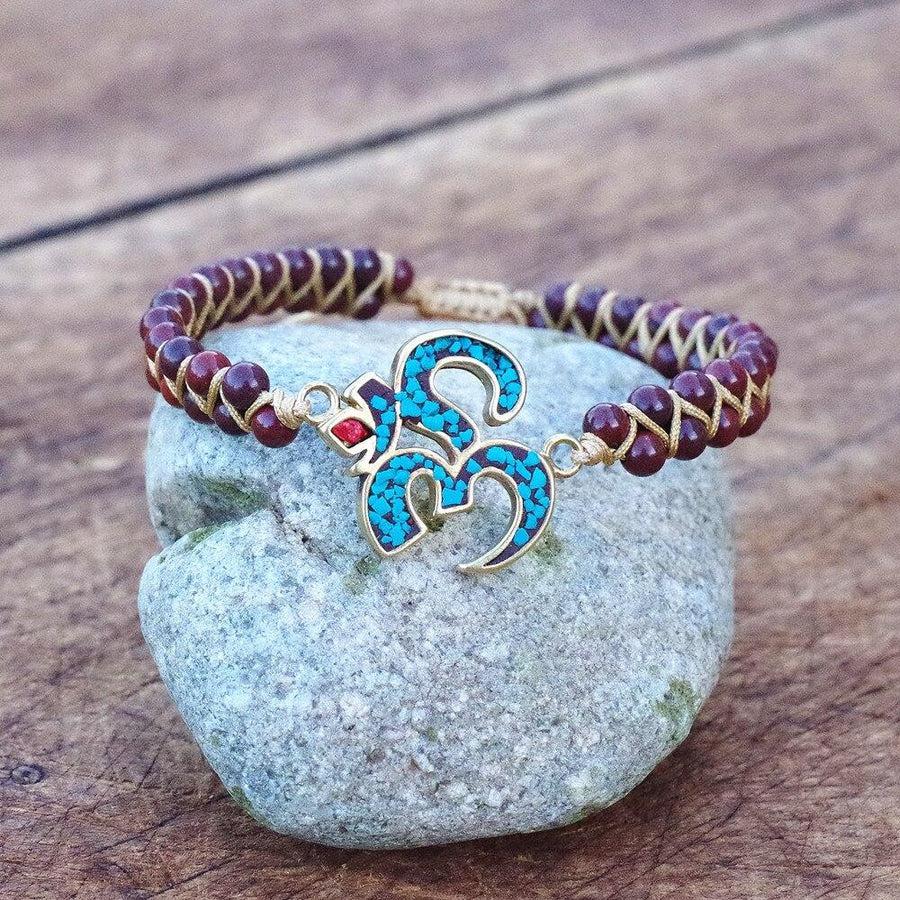 Détail du nœud coulissant du bracelet en améthyste