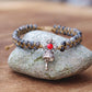 Bracelet Shamballa avec perles de labradorite et cloche tibétaine
