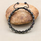 Vue latérale du bracelet Shamballa en pierres polies