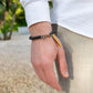 Bracelet bouddhiste avec perles gravées et tissage artisanal