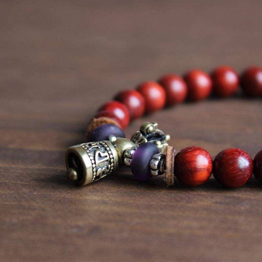 Bracelet tibétain en bois d'olivier avec clochette cuivre