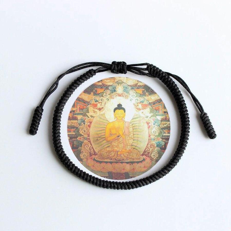 Bracelet noir élégant posé sur une surface claire