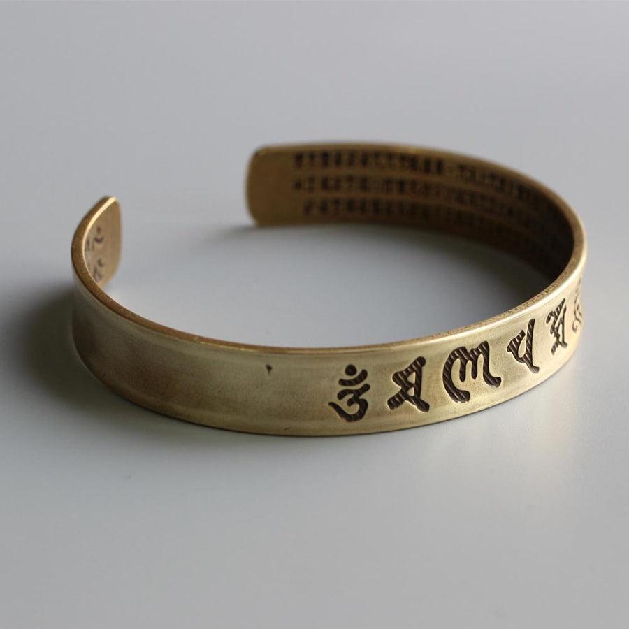Bracelet ajustable en laiton avec inscriptions bouddhistes