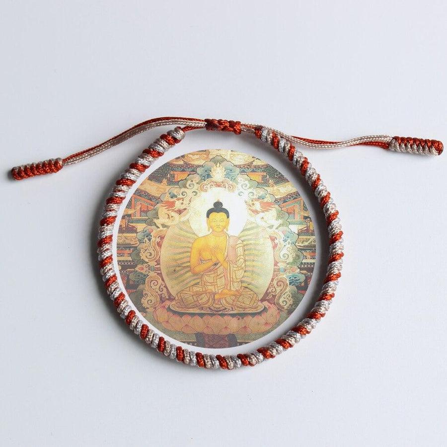Bracelet tibétain bicolore enroulé, mettant en valeur les couleurs