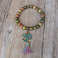 Bracelet tibétain avec perles d'Unakite et symbole Om