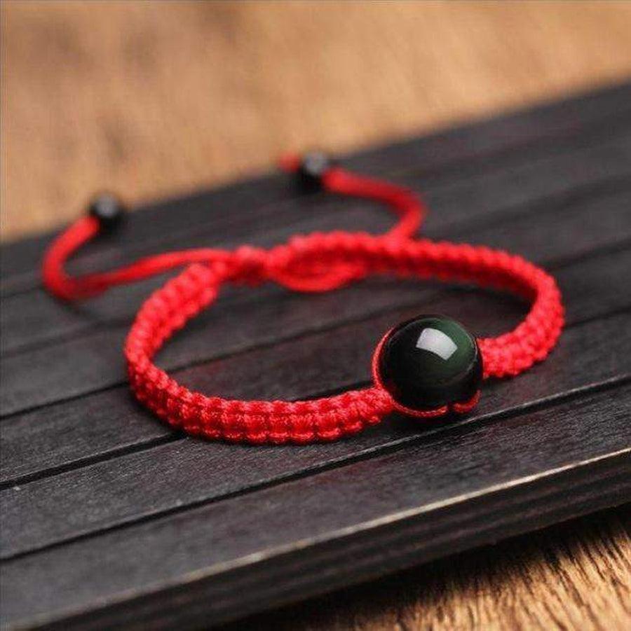 Bracelet ajustable avec pierre obsidienne, fond neutre