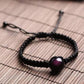 Obsidienne œil céleste sur bracelet tressé, vue rapprochée