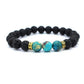 Bracelet en pierres de lave et turquoise posé à plat