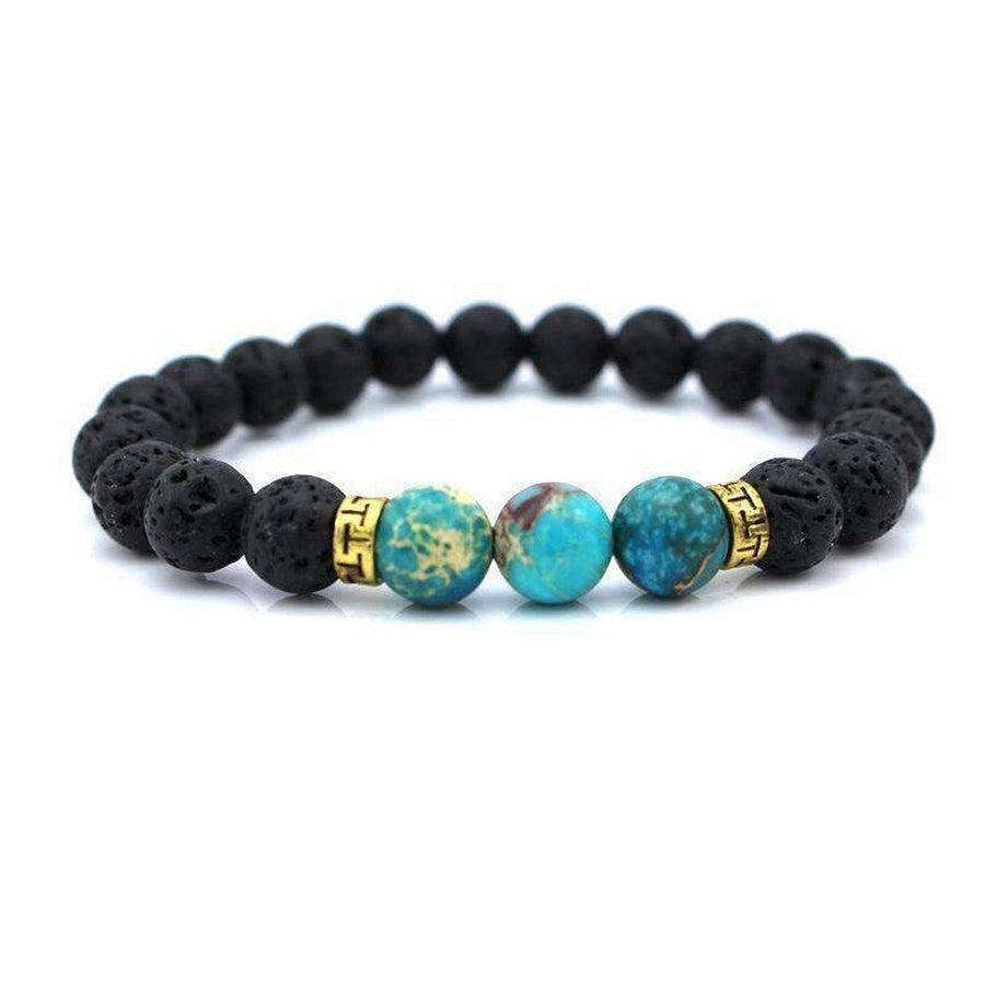 Bracelet en pierres de lave et turquoise posé à plat
