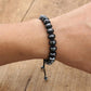 Bracelet en hématite avec nœud coulissant ajustable