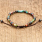 Bracelet en jaspe multicolore et hématite sur fond blanc