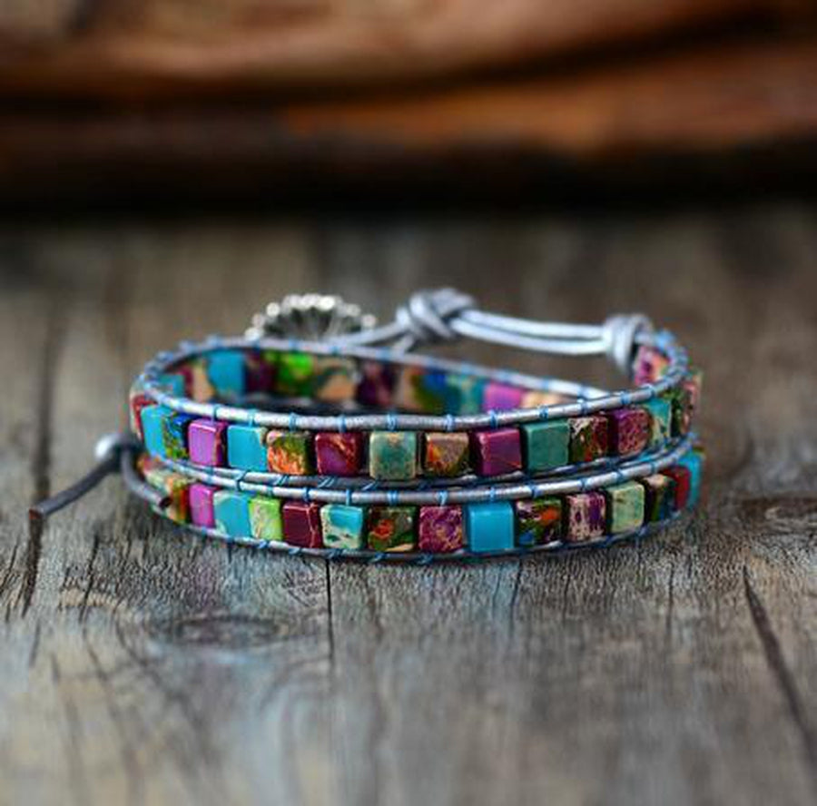 Fleur de lotus en acier sur bracelet en jaspe et cuir