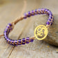 Bracelet spirituel en améthyste, symbole Om visible