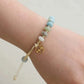 Bracelet en amazonite avec perles dorées et médaillon astrologique