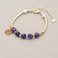Bracelet en améthyste avec médaillon astrologique doré
