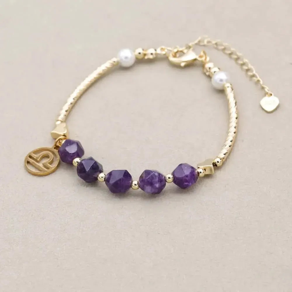 Bracelet en améthyste avec médaillon astrologique doré