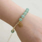 Bracelet en aventurine verte avec médaillon astrologique doré