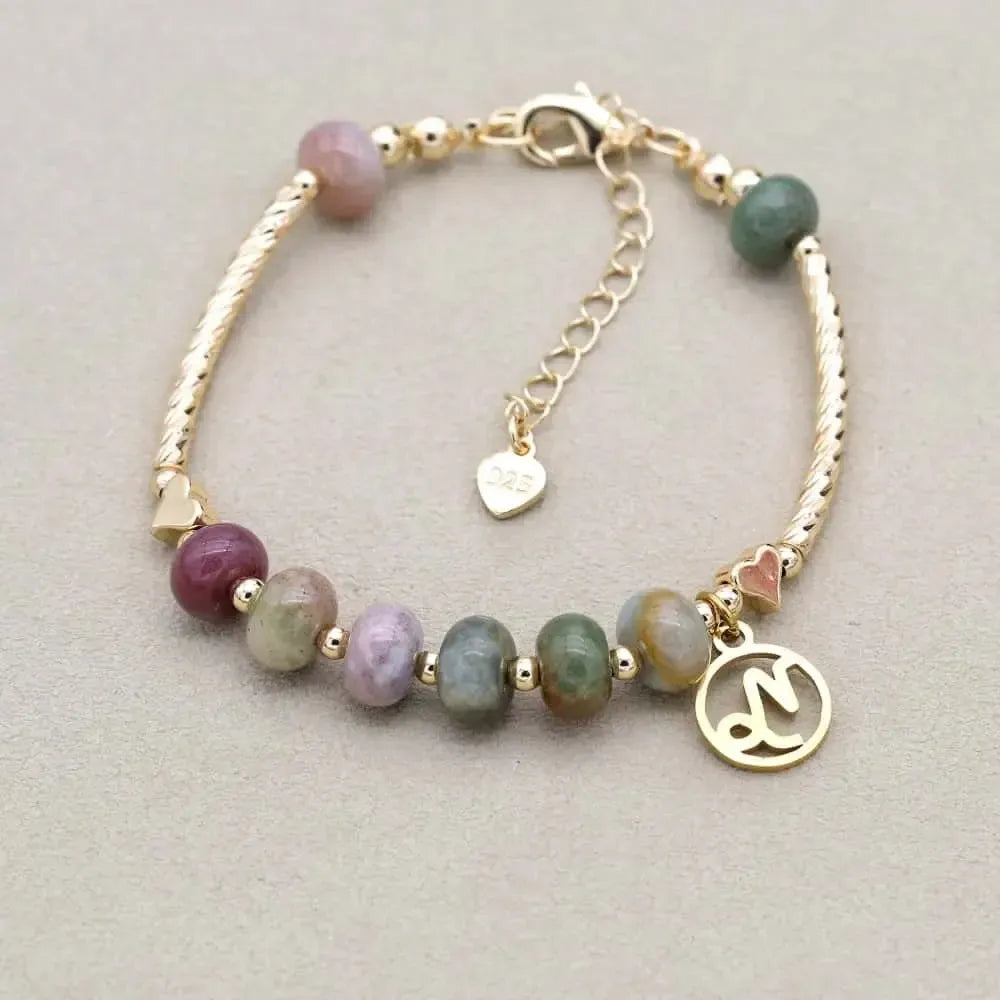 Bracelet avec chaînette ajustable et médaillon astrologique visible