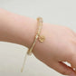 Bracelet en quartz fumé avec perles dorées et médaillon zodiaque