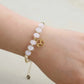 Bracelet en quartz rose avec perles dorées et médaillon zodiaque