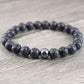 Bracelet en pierre de lave avec accents d'hématite