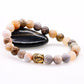 Bracelet extensible en pierres d'onyx avec Bouddha doré