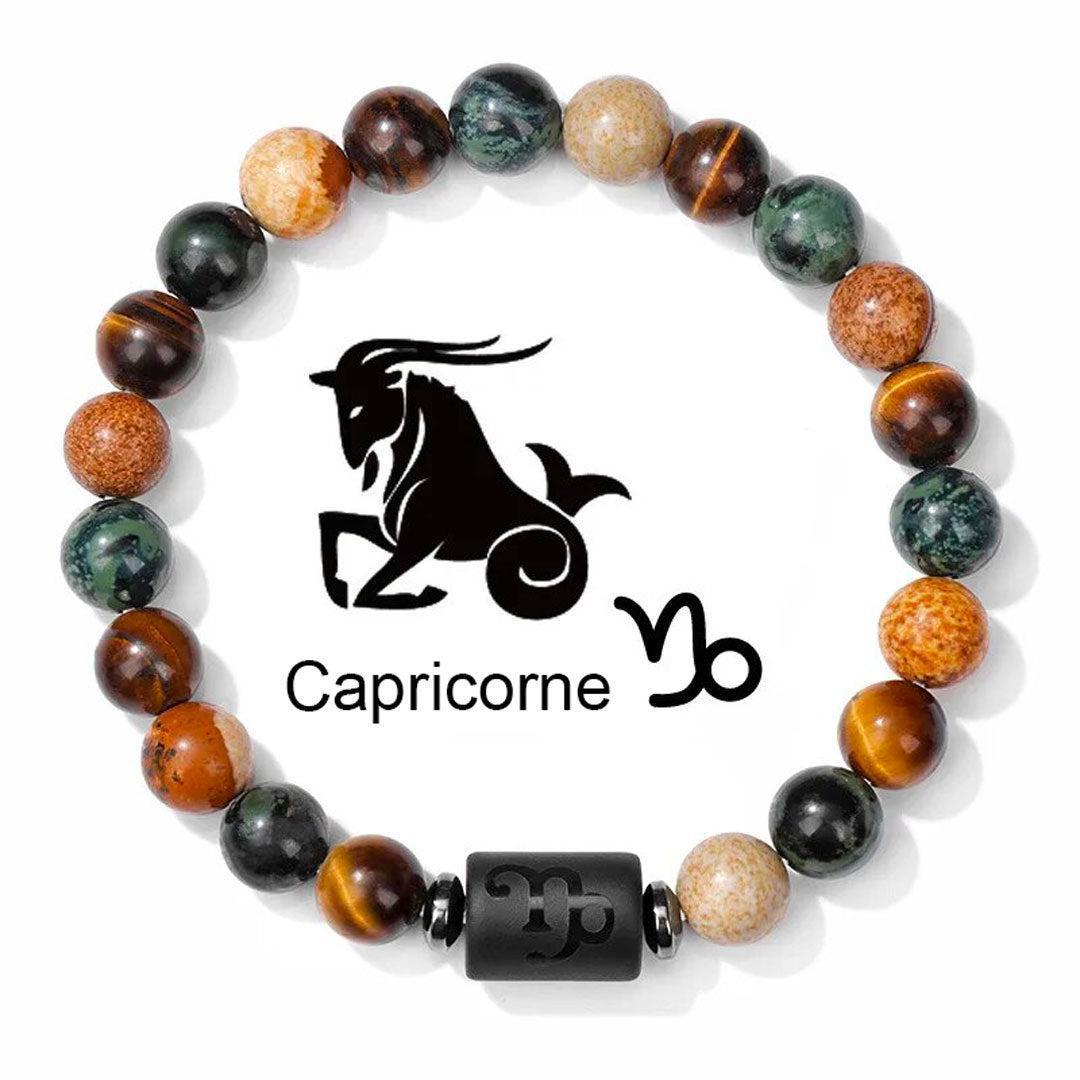 Gros plan sur les perles de jasper et hématite d'un bracelet zodiaque
