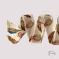 Ceinture foulard crème avec motifs de plumes colorées