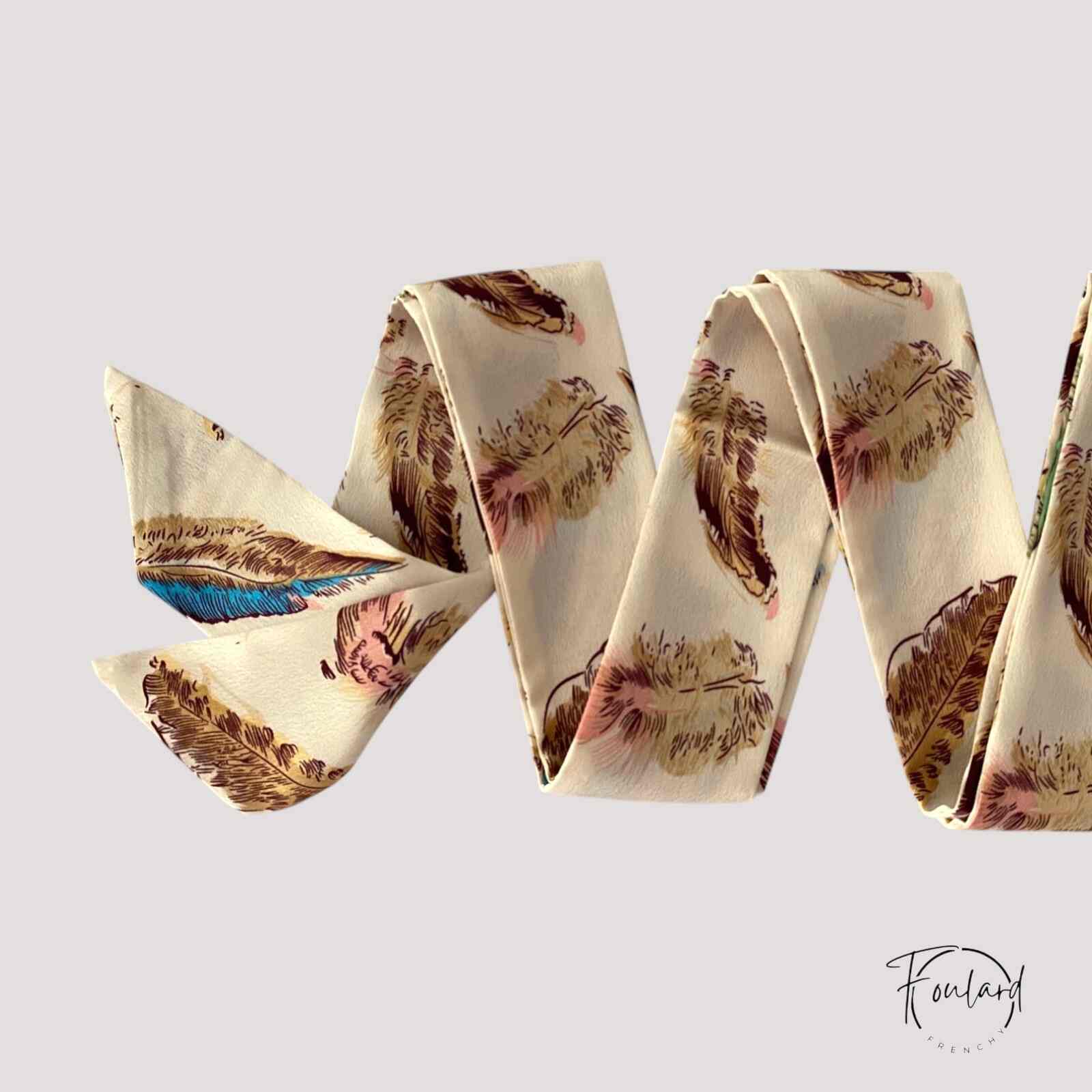 Ceinture foulard crème avec motifs de plumes colorées