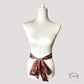 Noeud de ceinture foulard brique aux motifs graphiques