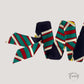Ceinture foulard rayée vert rouge sur fond blanc