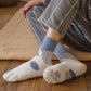 Chaussettes en laine bleues avec motif patte de chat