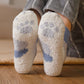 Chaussettes en laine avec rayures bleues et blanches