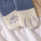 Texture moelleuse des chaussettes en laine douce