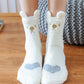 Vue d'ensemble des chaussettes polaires avec motifs chats