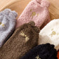 Chaussettes polaires blanches, texture douce et épaisse